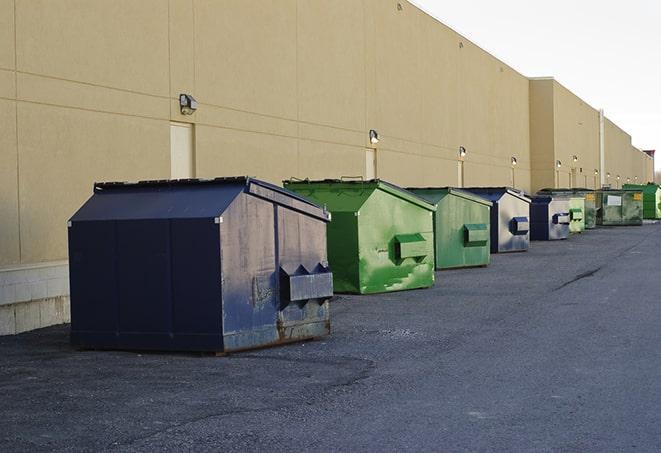 a site supervisor checking a construction dumpster in Azusa, CA